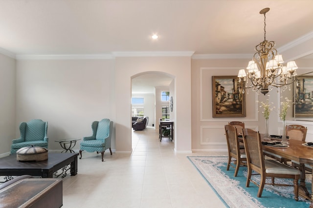 dining area with ornamental molding, light tile patterned floors, and a chandelier