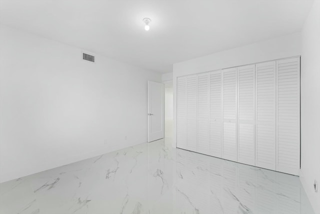 unfurnished bedroom with a closet