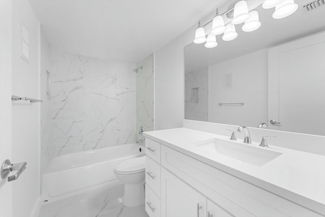 full bathroom with vanity, tiled shower / bath combo, and toilet