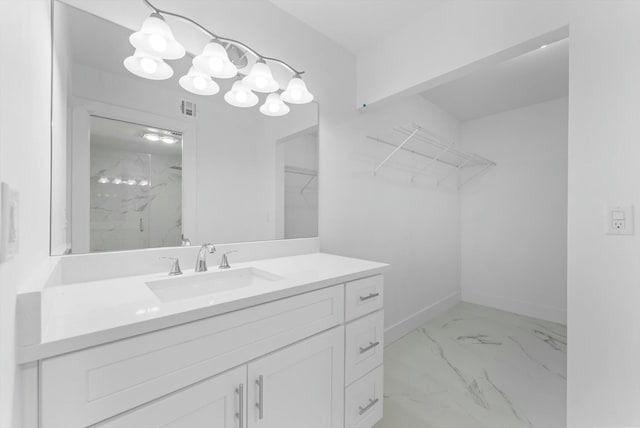 bathroom featuring vanity and a shower with shower door