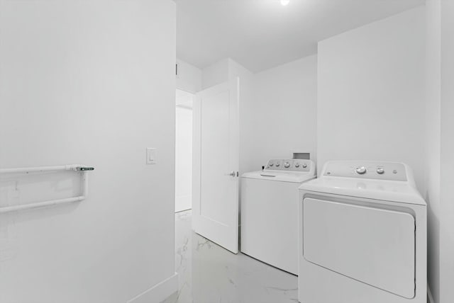 washroom featuring independent washer and dryer