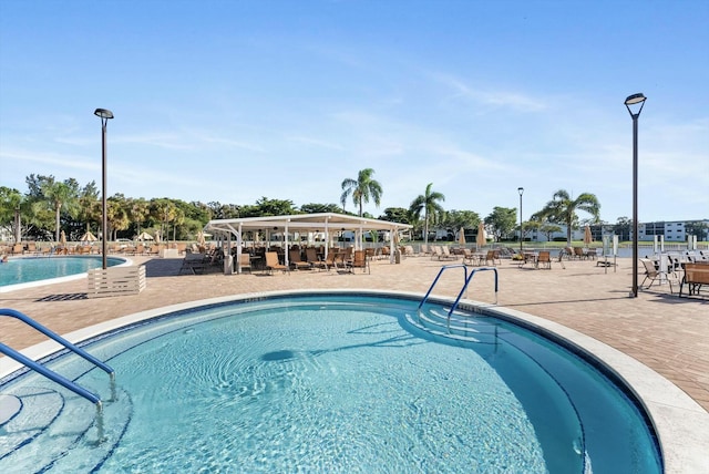 view of pool featuring a patio area