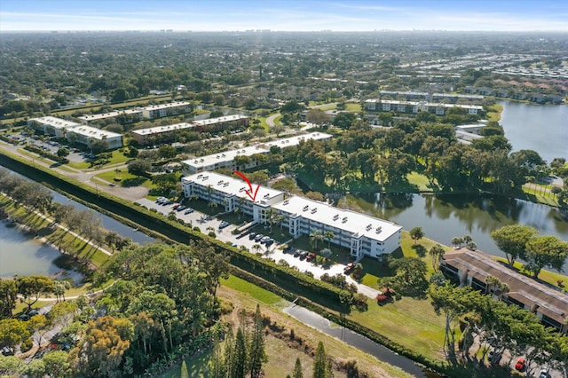 drone / aerial view with a water view