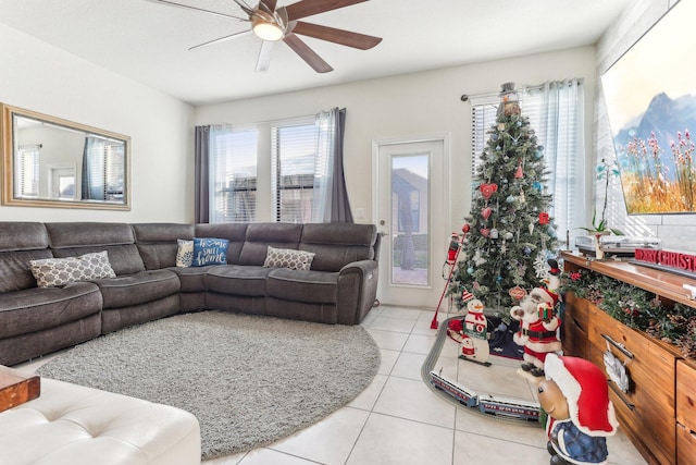 living room featuring ceiling fan and light tile patterned floors