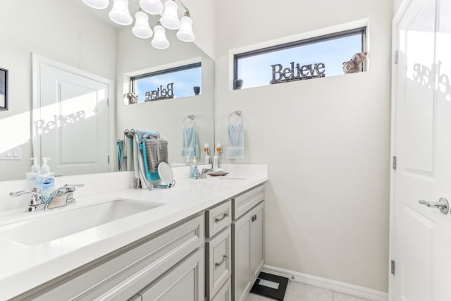 bathroom with tile patterned floors and vanity