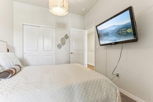 bedroom with carpet floors and a closet