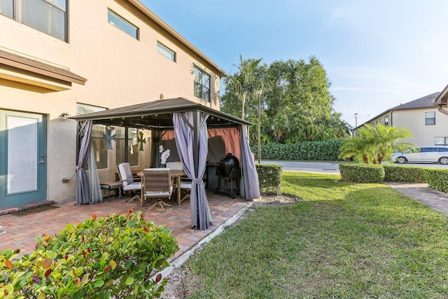 view of yard featuring a gazebo and a patio