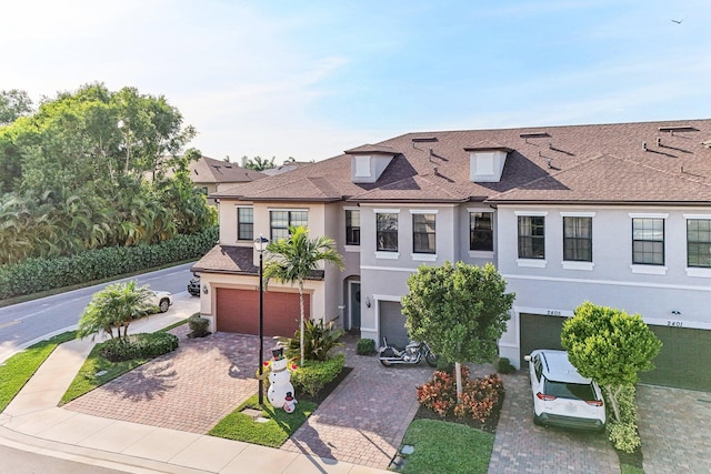 townhome / multi-family property featuring a garage