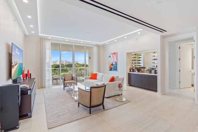 tiled living room with bar and floor to ceiling windows