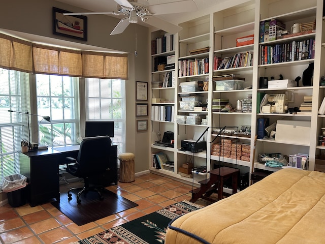 tiled office featuring ceiling fan