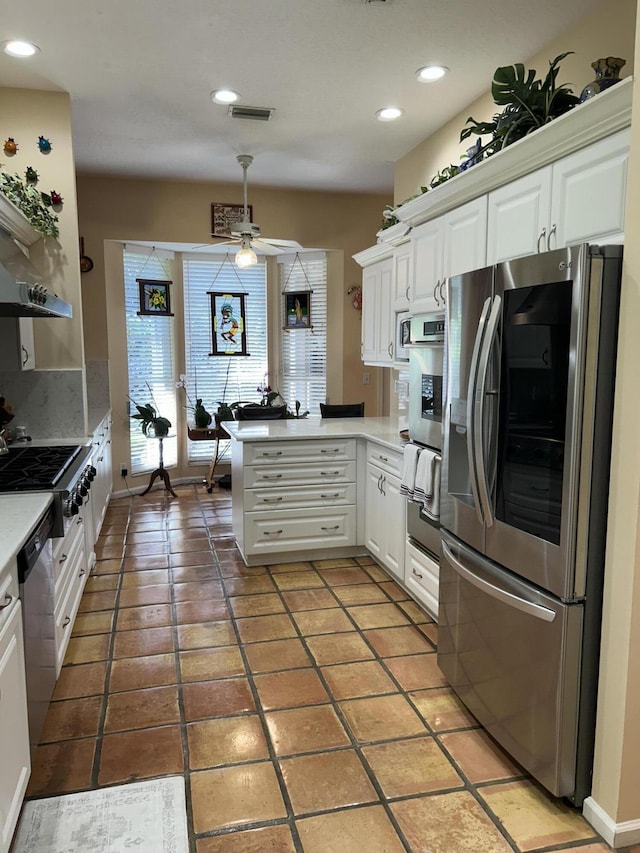 kitchen featuring ceiling fan, white cabinetry, kitchen peninsula, and appliances with stainless steel finishes