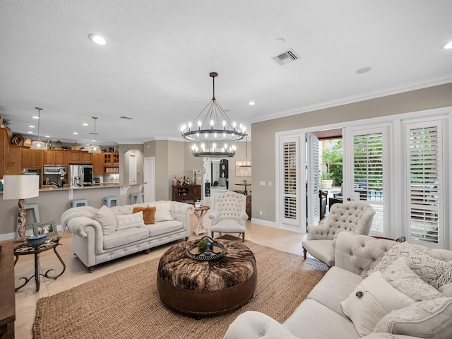 living room featuring light tile patterned floors, ornamental molding, and an inviting chandelier