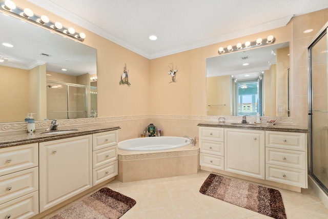 bathroom with tile patterned floors, vanity, crown molding, and independent shower and bath