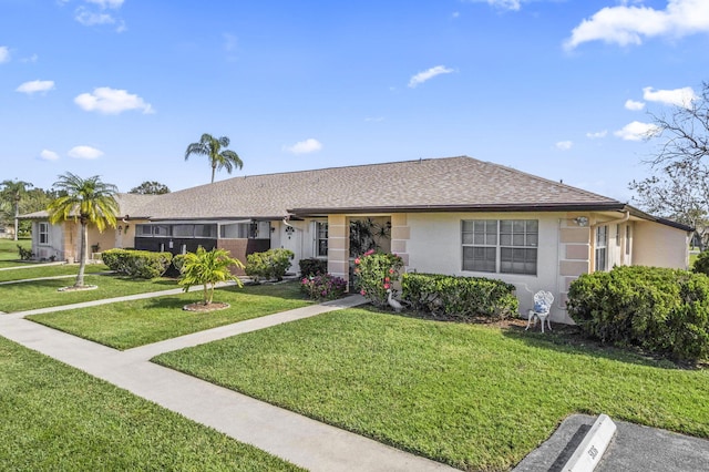 ranch-style home featuring a front yard