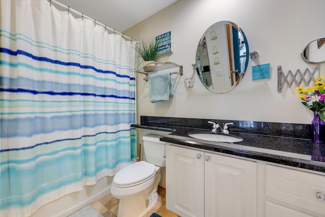 full bathroom with vanity, shower / bath combination with curtain, and toilet