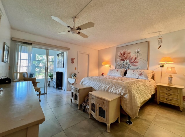 tiled bedroom featuring a textured ceiling, access to outside, and ceiling fan