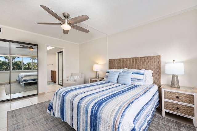 tiled bedroom featuring ceiling fan and ornamental molding