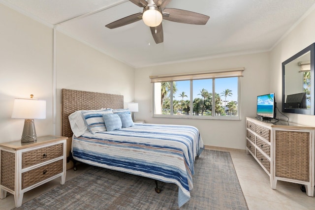 bedroom featuring ceiling fan, light tile patterned floors, a textured ceiling, and ornamental molding