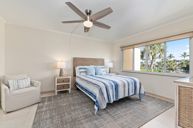 bedroom with ceiling fan and light tile patterned floors