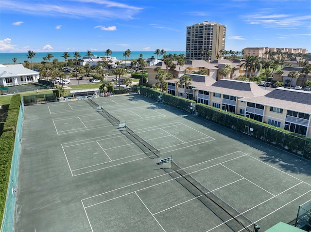 view of sport court featuring a water view