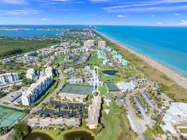 bird's eye view featuring a water view and a view of the beach