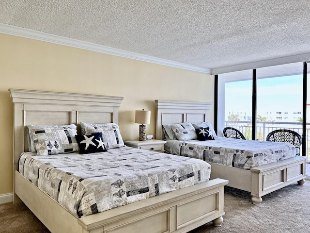 bedroom featuring carpet flooring, a textured ceiling, and ornamental molding