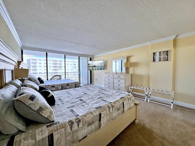 carpeted bedroom featuring ornamental molding and a textured ceiling