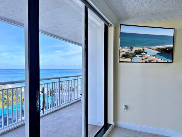 balcony with a view of the beach and a water view