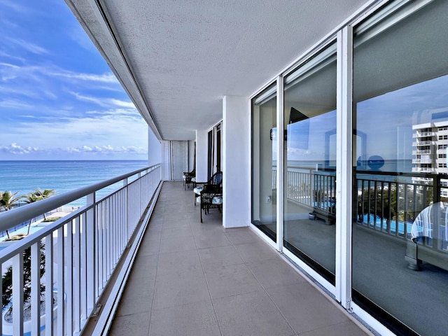 balcony featuring a water view