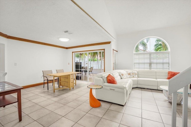 tiled living room featuring a textured ceiling, a wealth of natural light, and crown molding