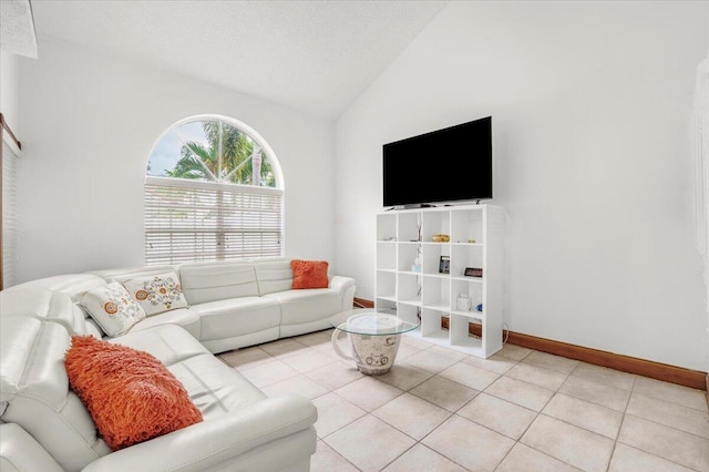 living room featuring light tile patterned floors, a textured ceiling, and vaulted ceiling