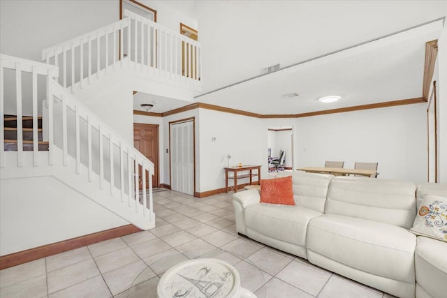 tiled living room with ornamental molding