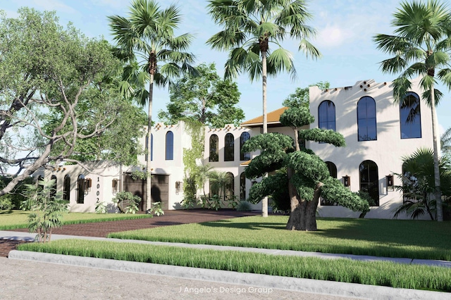 mediterranean / spanish house featuring a front yard