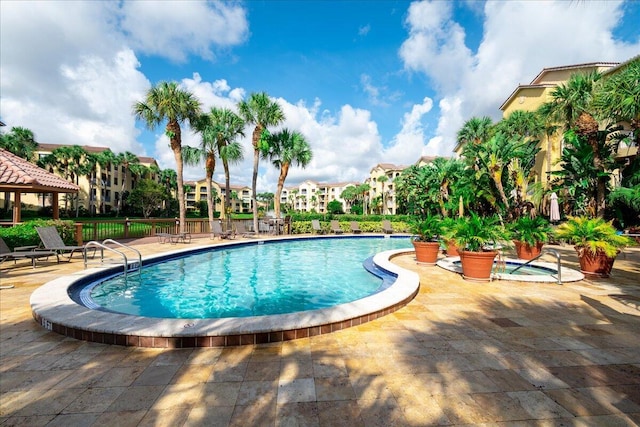 view of swimming pool featuring a patio area