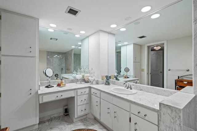 bathroom with a shower and vanity