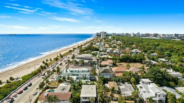 birds eye view of property featuring a water view and a view of the beach