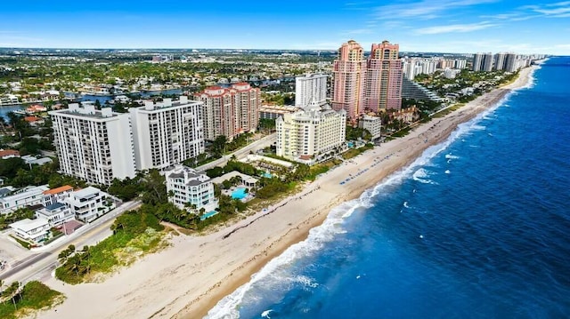 drone / aerial view featuring a view of the beach and a water view