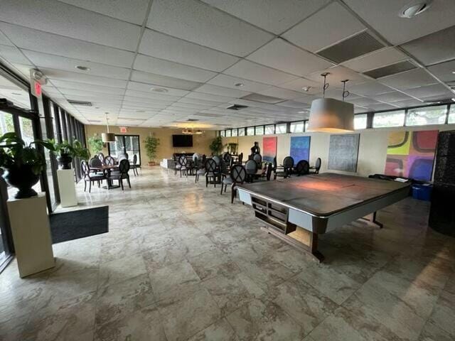 playroom featuring a paneled ceiling