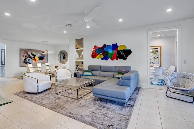 living room featuring ceiling fan and light tile patterned floors