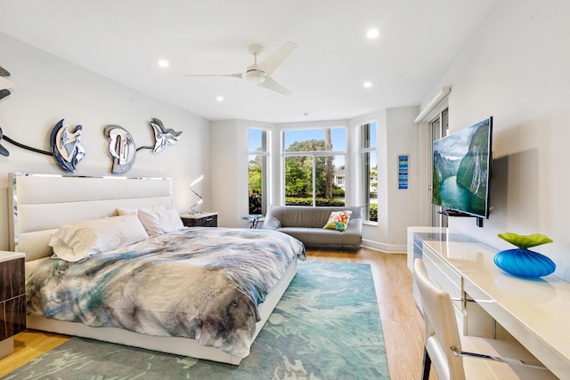 bedroom featuring light hardwood / wood-style floors and ceiling fan