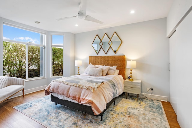 bedroom featuring hardwood / wood-style floors and ceiling fan