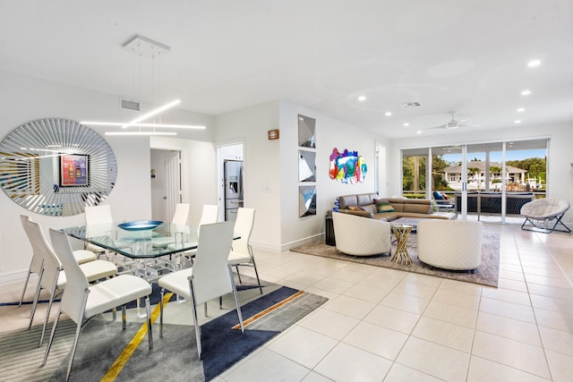 dining space with ceiling fan and light tile patterned floors