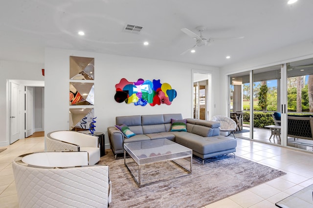 living room with ceiling fan and light tile patterned floors