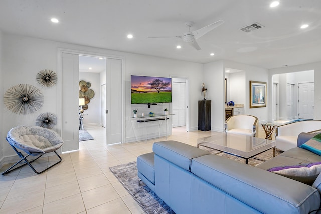 living room with ceiling fan and light tile patterned flooring