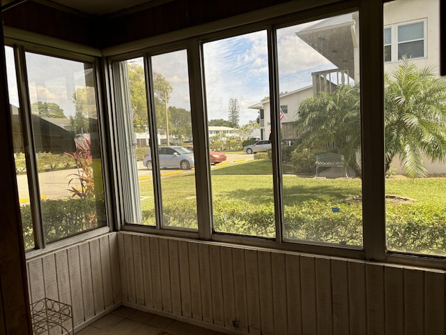 unfurnished sunroom with plenty of natural light