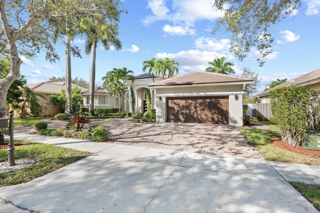 view of front of property with a garage