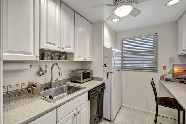 kitchen featuring sink, white cabinets, black dishwasher, white fridge, and light tile patterned flooring