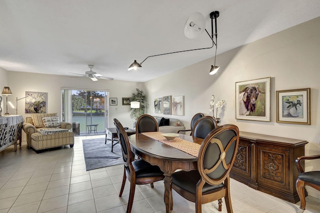 dining space featuring ceiling fan and light tile patterned floors