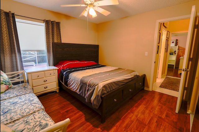 bedroom featuring ceiling fan and dark hardwood / wood-style floors