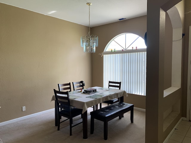 dining space with a chandelier